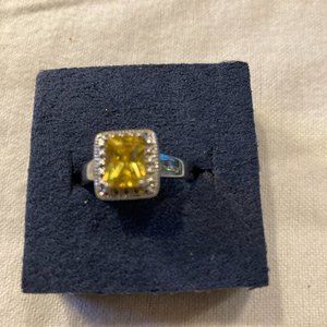 Silver Tone Design Accents with a Yellow Sapphire